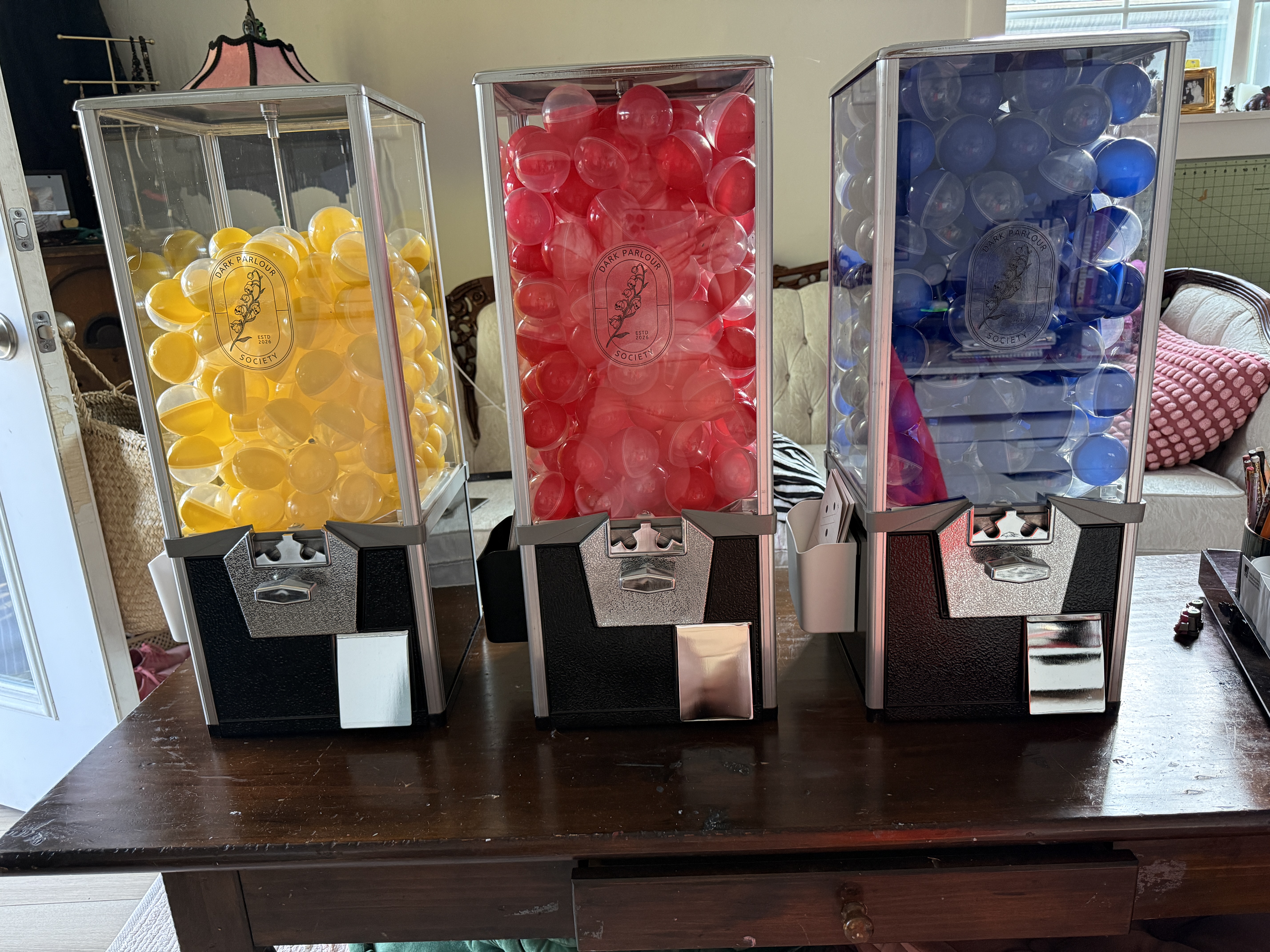 Three Dark Parlour Society fortune capsule machines